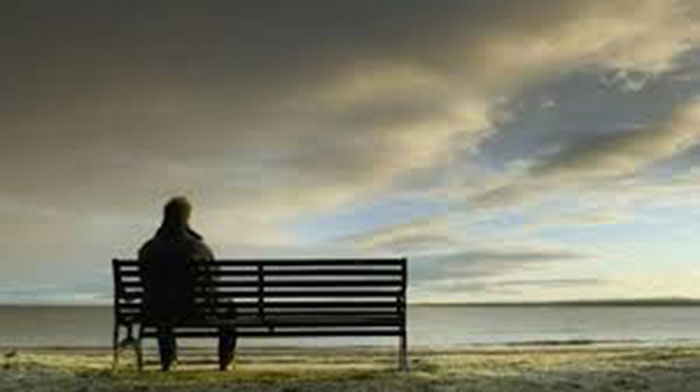 man sitting on bench