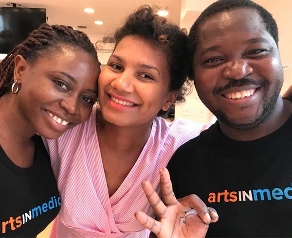 three people smiling because of the gift of hope